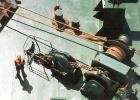 bowofship  This is part of the bow of the ship. The man standing there give some idea of the size of the mooring ropes and anchor chain.
