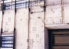 wall  You can see signs of the war everywhere in Warsaw. Here are some bullet holes, and places where they have been repaired in one of the government buildings.