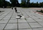 P1000388  Bishkek  Note the open manhole in the middle of the pavement.